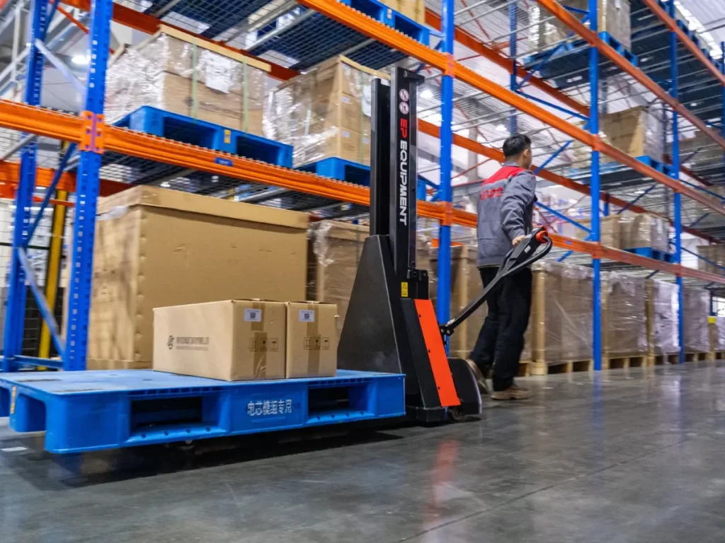 EPT12-F3H electric pallet truck moving daily stock through a warehouse